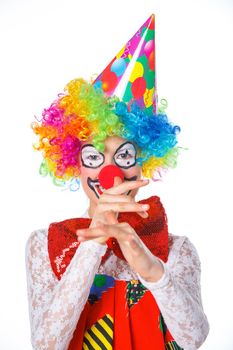 Portrait of a cute girl clown. Isolated on white background.