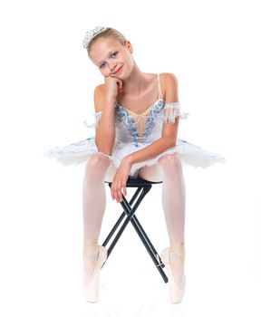 Beautiful young ballerina on a white background