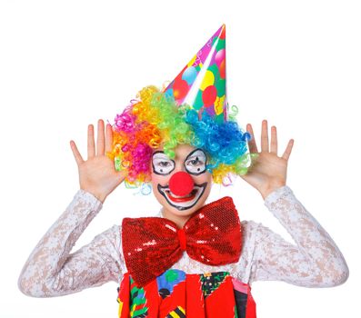 Portrait of a cute girl clown. Isolated on white background.