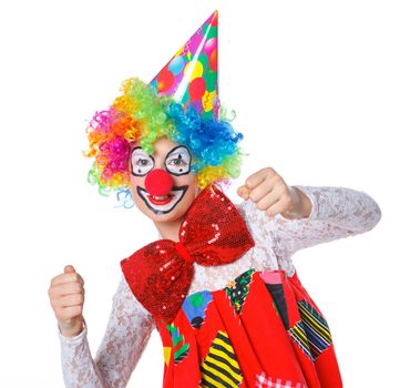 Portrait of a cute girl clown. Isolated on white background.