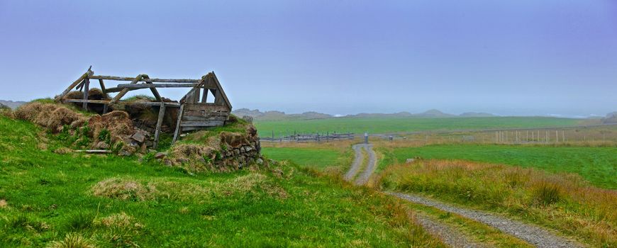 Traditional house with the grass covered roof, West fjords, Iceland. Panorama