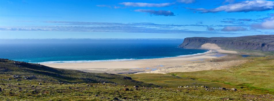 Landscape with white beach at Iceland ocean coast. Panorama.