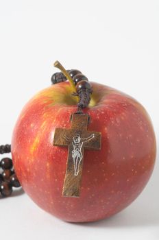 Bible Eva's Sin Red Apple over a White Background