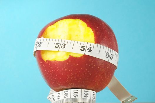 Diet Apple and Meter on a Colored Background
