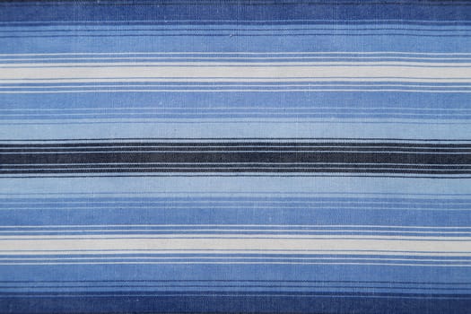 Close-up of a piece of blue and white striped fabric