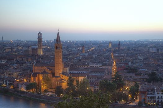 Verona, northern Italy. View of city and river in afternoon sunlight