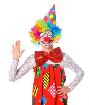 Portrait of a cute girl clown. Isolated on white background.