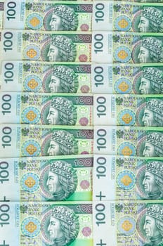 Background of 100 PLN (polish zloty) banknotes laying in a row