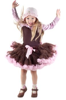 Shot of jumping little girl with long blond hair in studio