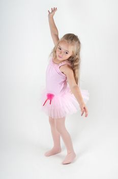 Studio shot of ballet dancer doing pas