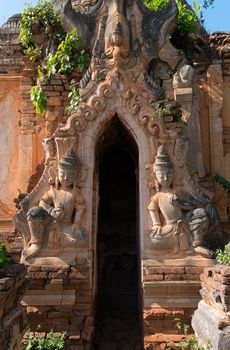 Guardians on ruins of ancient Burmese Buddhist pagoda Nyaung Ohak in the village of Indein on Inlay Lake in Shan State, Myanmar (Burma).