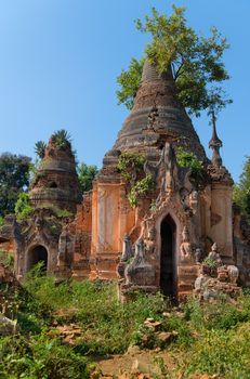 Ruins of ancient Burmese Buddhist pagodas Nyaung Ohak in the village of Indein on Inlay Lake in Shan State, Myanmar (Burma).