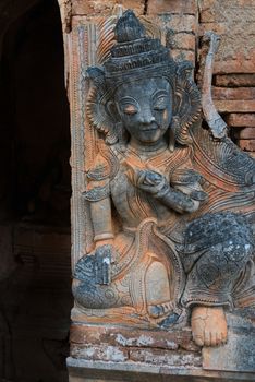 Guardian on ruins of ancient Burmese Buddhist pagoda Nyaung Ohak in the village of Indein on Inlay Lake in Shan State, Myanmar (Burma).