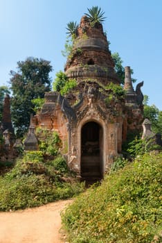Ruins of ancient Burmese Buddhist pagoda Nyaung Ohak in the village of Indein on Inlay Lake in Shan State, Myanmar (Burma).