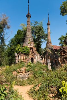 Ruins of ancient Burmese Buddhist pagodas Nyaung Ohak in the village of Indein on Inlay Lake in Shan State, Myanmar (Burma).