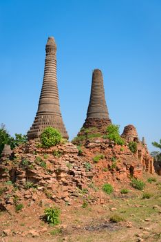 Ruins of ancient Burmese Buddhist pagodas in the village Nyaung Ohak of Indein on Inlay Lake in Shan State, Myanmar (Burma).