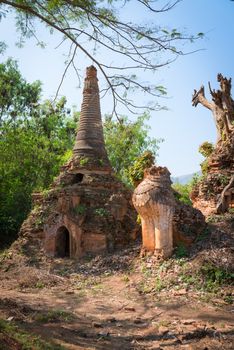Ruins of lion statue in ancient Burmese Buddhist pagodas Nyaung Ohak in the village of Indein on Inlay Lake in Shan State, Myanmar (Burma).
