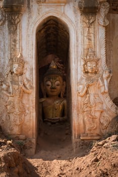 Buddha image inside of ancient Burmese Buddhist pagodas Nyaung Ohak in the village of Indein on Inlay Lake in Shan State, Myanmar (Burma).