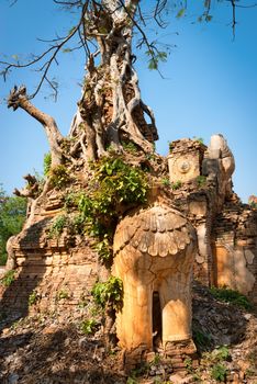 Ruins of lion statue in ancient Burmese Buddhist pagodas Nyaung Ohak in the village of Indein on Inlay Lake in Shan State, Myanmar (Burma).