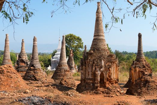 Ruins of ancient Burmese Buddhist pagodas Nyaung Ohak in the village of Indein on Inlay Lake in Shan State, Myanmar (Burma).