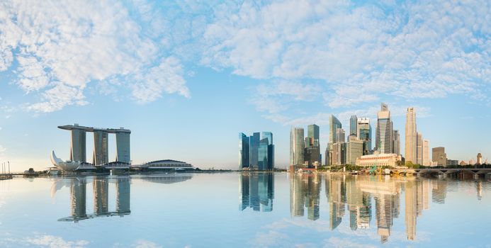 Singapore skyline of business district with skyscrapers and Marina Bay Sands at morning under blue sky