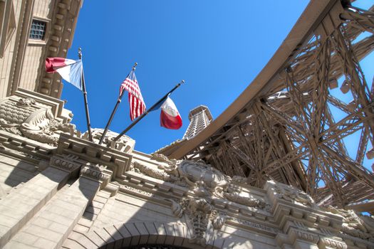 Eifel Tower with American and French Flags shot from low perspective