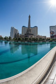 Las Vegas strip in the background with walkway and water in the foreground