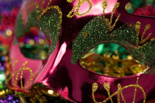 Colorful Mardi Gras Mask with beaded background