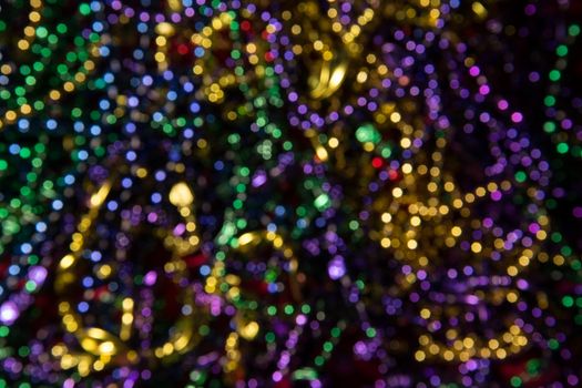 Abstract background of out of focus Mardi Gras Beads