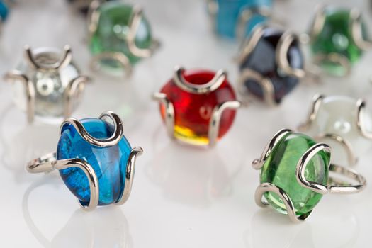 Murano glass ring collection on white background