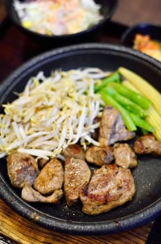 Beef steak with vegetable in hot pan