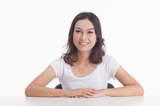 Asian woman isolated on white background. white t-shirt, sit on chair with table