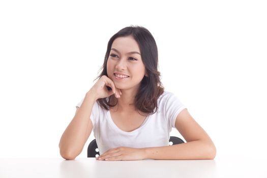 Asian woman isolated on white background. white t-shirt, sit on chair with table