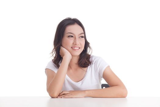 Asian woman isolated on white background. white t-shirt, sit on chair with table