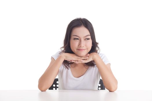 Asian woman isolated on white background. white t-shirt, sit on chair with table