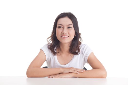 Asian woman isolated on white background. white t-shirt, sit on chair with table