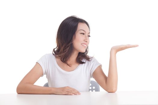 Asian woman isolated on white background. white t-shirt, sit on chair with table