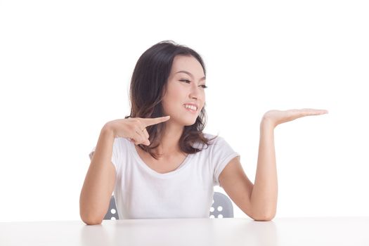 Asian woman isolated on white background. white t-shirt, sit on chair with table