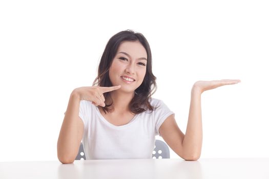 Asian woman isolated on white background. white t-shirt, sit on chair with table