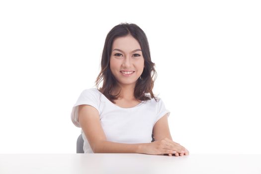 Asian woman isolated on white background. white t-shirt, sit on chair with table