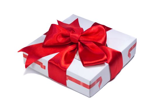 A beautifully decorated and tied with a ribbon box with a gift for the holiday, celebration, anniversary. Presents on a white background.