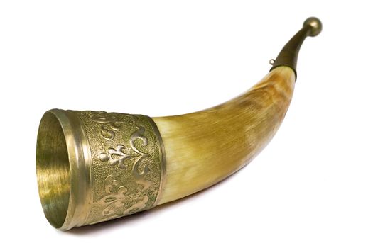 Made from animal horns and decorated with engraving on metal, wine vessel. Presented on a white background.