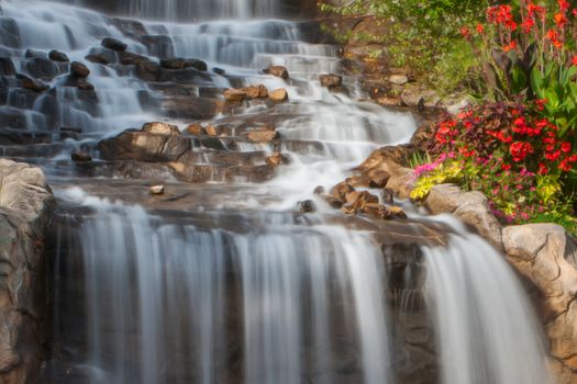 A small Waterfall at the rivers bank in soft focus