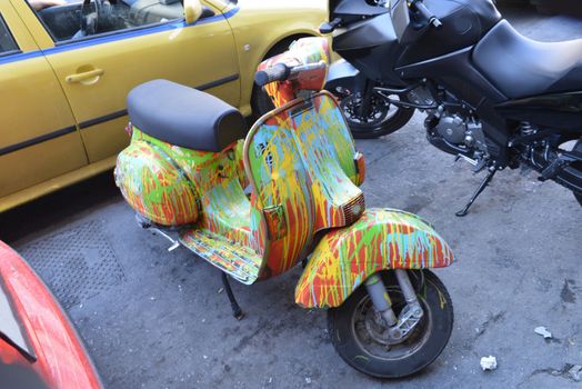 A painted scooter in the streets of Athens.