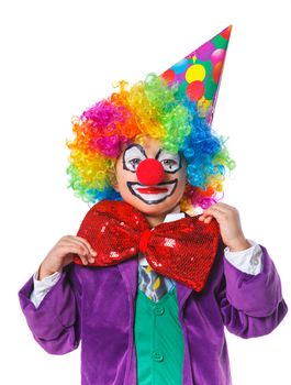 Portrait of a cute boy clown. Isolated on white background.