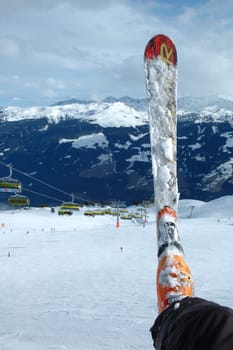 Ski and boot on the slope nearby Kaltenbach in Zillertal valley in Austria