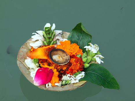 flowers and candle for the god wishes on the river ganges        