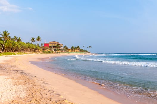 Tropical beach in southern part of Sri Lanka at sunset