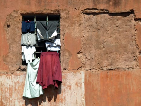 old red house in Jaipur,India and clothes on the window        
