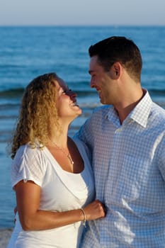 A happy woman and man in love at beach.